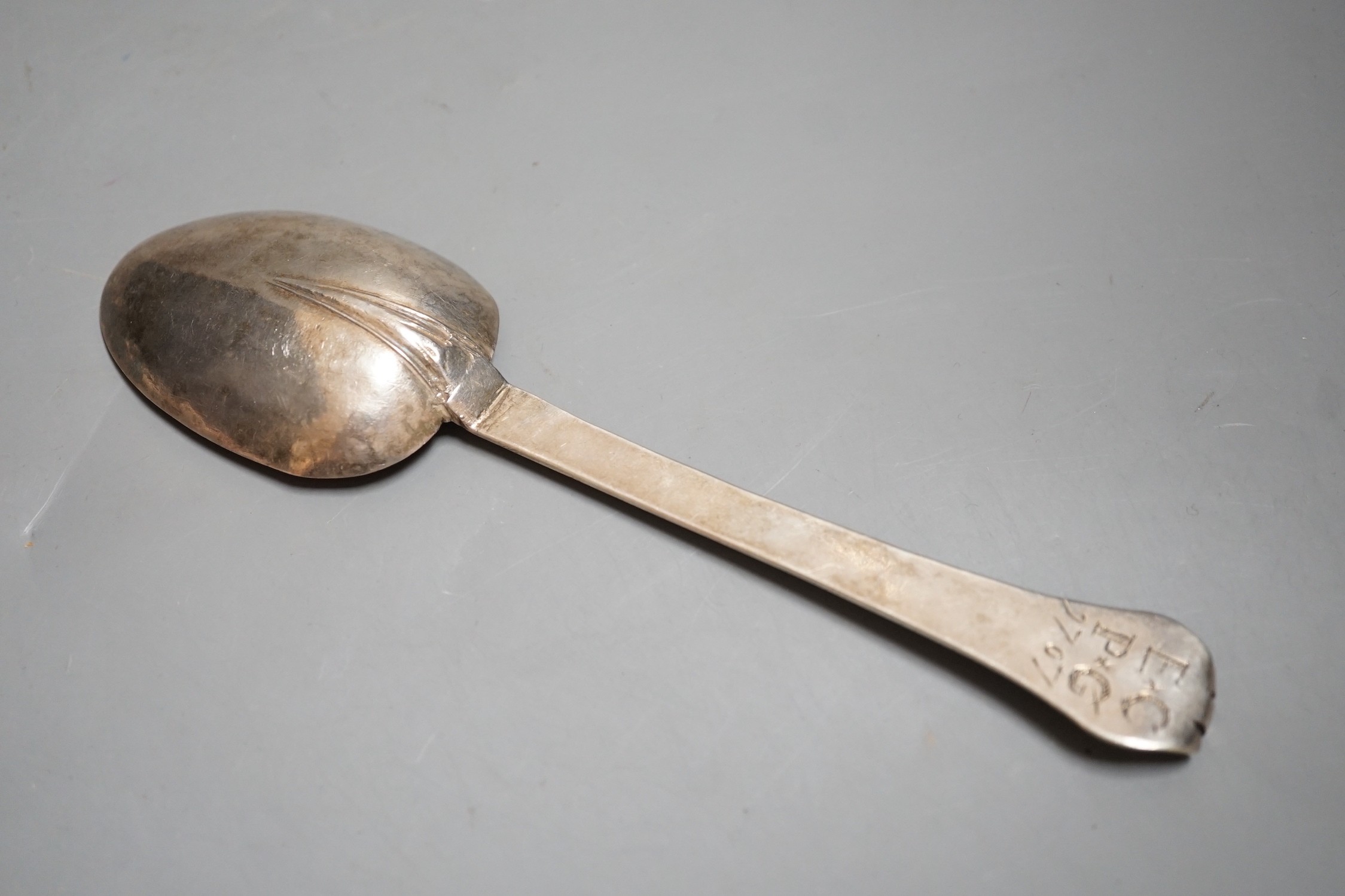 An early 18th century white metal trefid spoon, with engraved initials and date (repair), 19.1cm unmarked, 47 grams.